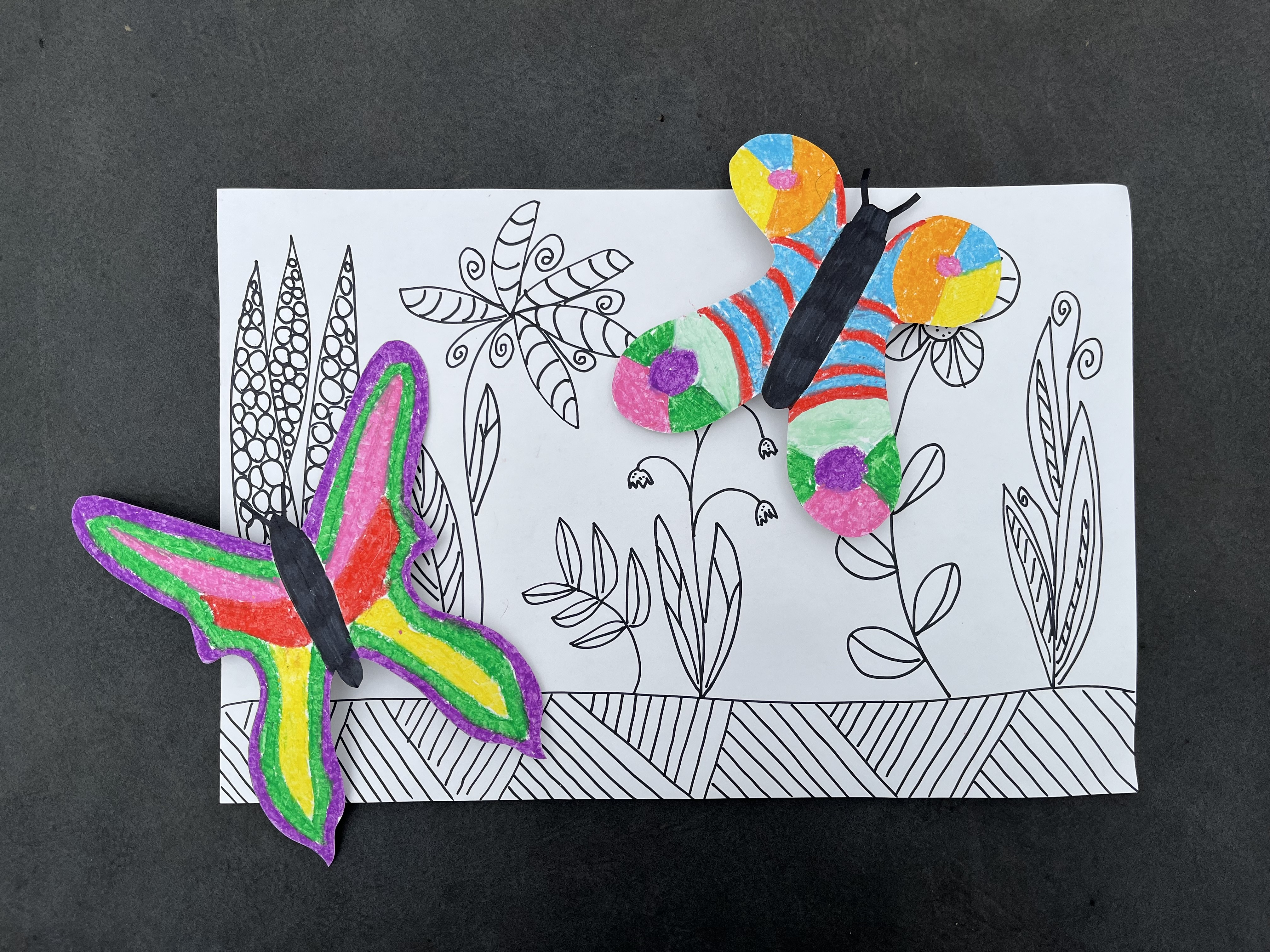 3-D butterflies coming off of a black and white drawing 